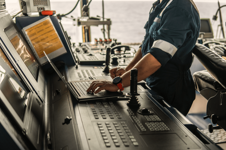marine navigational officer using laptop